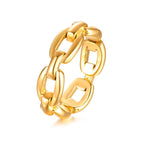 Gold chain-style ring on a white background