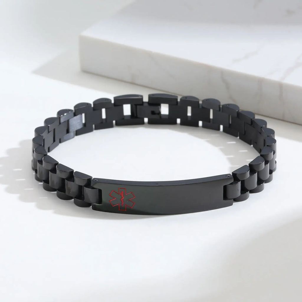 Black personalized medical ID link bracelet displayed in an everyday setting with the engraved ID plate visible.