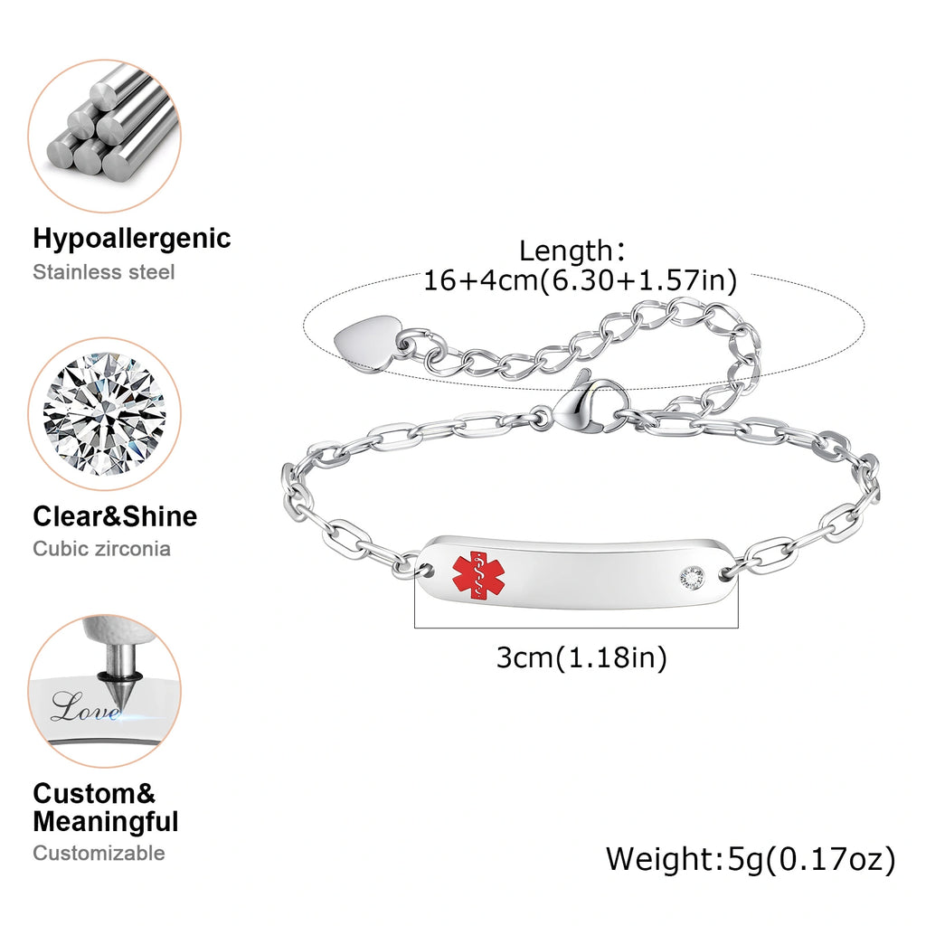 Silver ID bracelet with a red medical cross symbol on a polished bar, shown with dimension labels, weight, and feature callouts including hypoallergenic stainless steel, clear cubic zirconia, and customizable text.