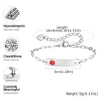 Silver ID bracelet with a red medical cross symbol on a polished bar, shown with dimension labels, weight, and feature callouts including hypoallergenic stainless steel, clear cubic zirconia, and customizable text.