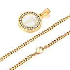 Gold medical ID necklace detail showing the round CZ pendant, stainless steel chain, and pendant bail.