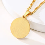 Back view of a gold stainless steel medical ID pendant showing the smooth personalized engraving area.