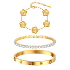 Three-piece gold tone bracelet set featuring a five-flower chain bracelet, sparkling cubic zirconia tennis bracelet, and stainless steel crystal bangle.