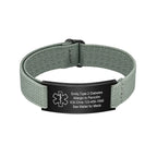 Green custom medical ID bracelet with adjustable elastic band and black stainless steel engraving plate.