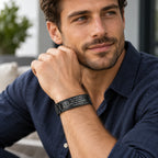 Man wearing a black stainless steel medical ID link bracelet on his wrist.