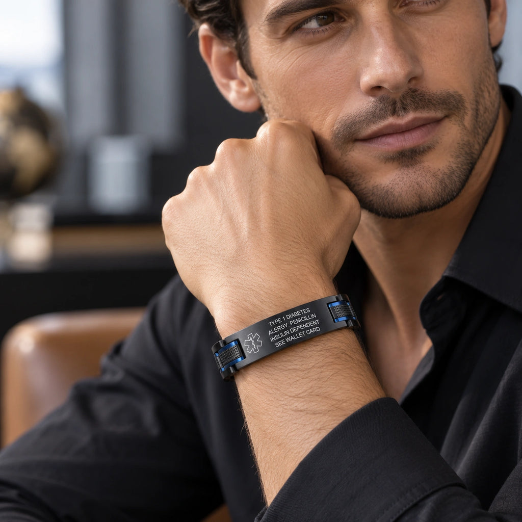 Man wearing a black and blue stainless steel medical ID link bracelet on his wrist.
