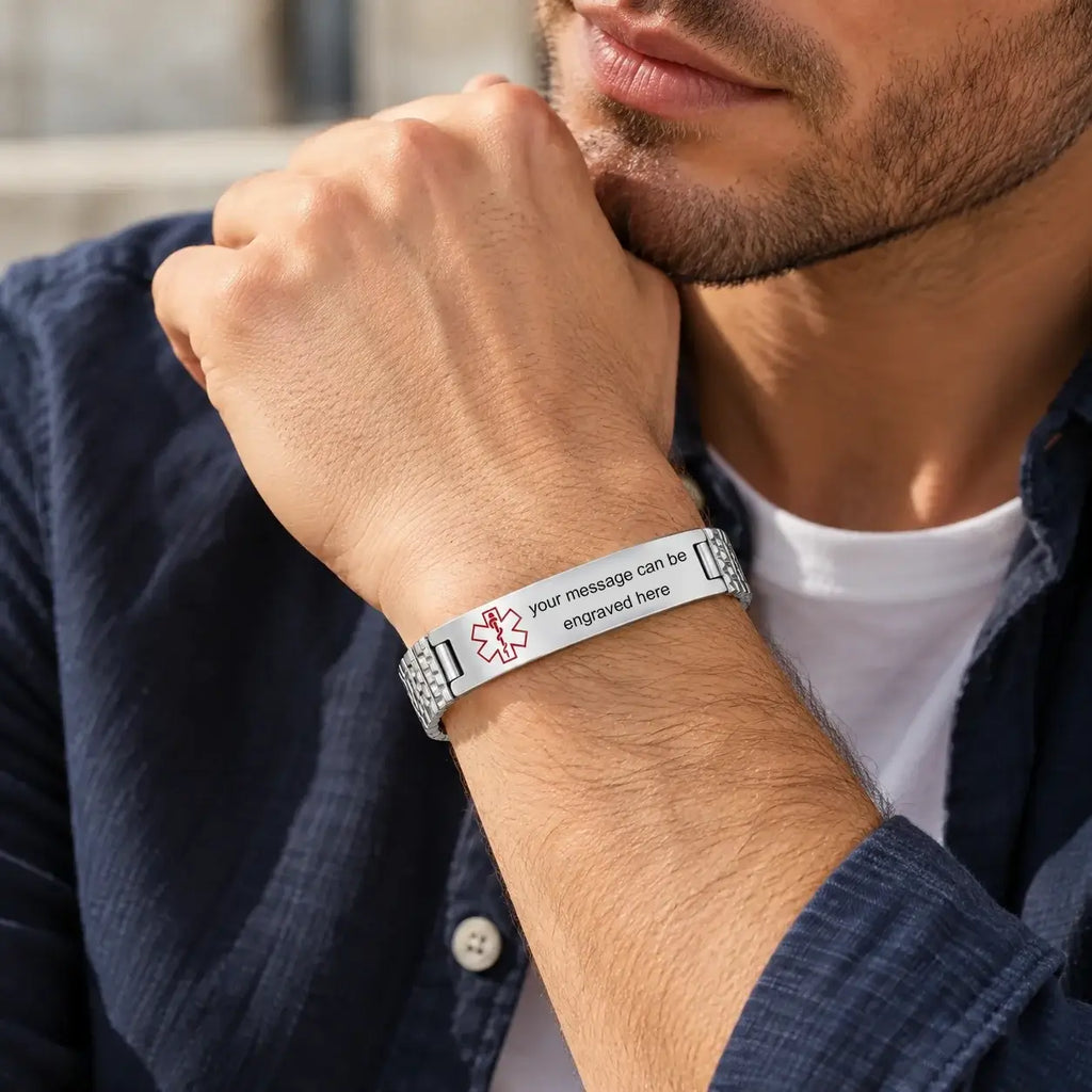 Man wearing a silver stretch medical ID bracelet with a polished stainless steel plate
