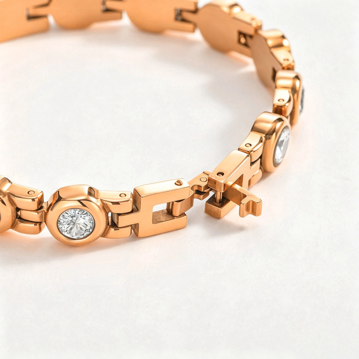 Close-up of a rose gold CZ medical ID bracelet showing the decorative links and open clasp mechanism.