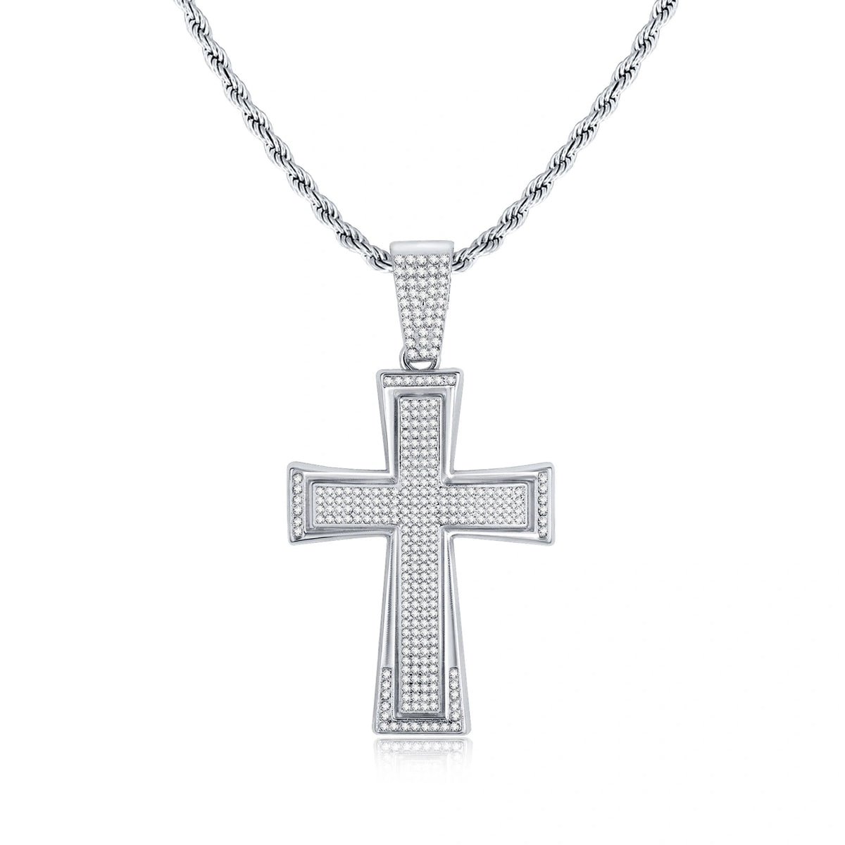 Silver tone iced out cross pendant necklace featuring sparkling rhinestones, a large cross design, and a textured rope chain on a white background.