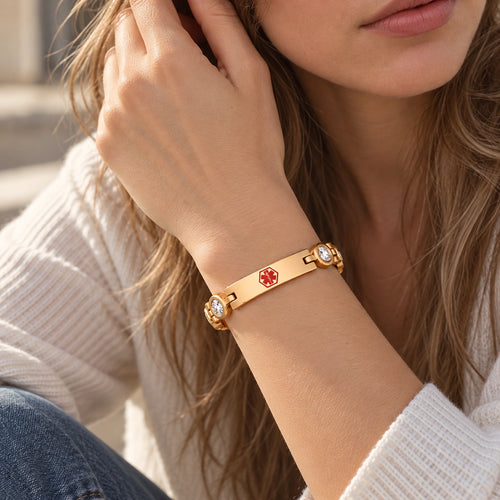 Woman wearing a rose gold medical ID link bracelet with sparkling CZ accents and engraved ID plate.