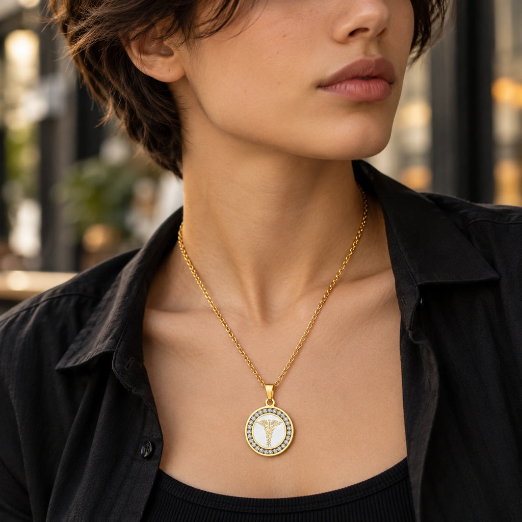 Woman wearing a gold round medical ID necklace with sparkling CZ accents and medical symbol.