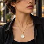 Woman wearing a gold round medical ID necklace with sparkling CZ accents and medical symbol.