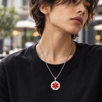 Woman wearing a silver octagonal medical ID necklace with a red medical alert symbol.